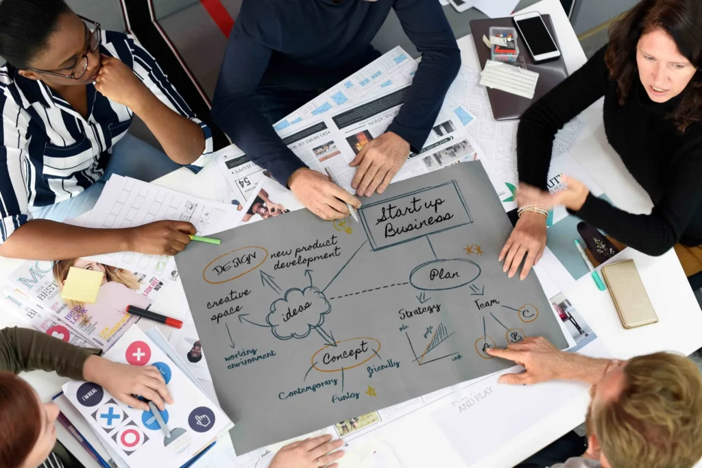 The Pure Marketing Inc. team working on branding and print services for clients in Canada.
